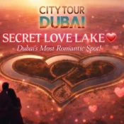 Romantic aerial view of Love Lake Dubai heart-shaped lake at sunset with couple silhouette